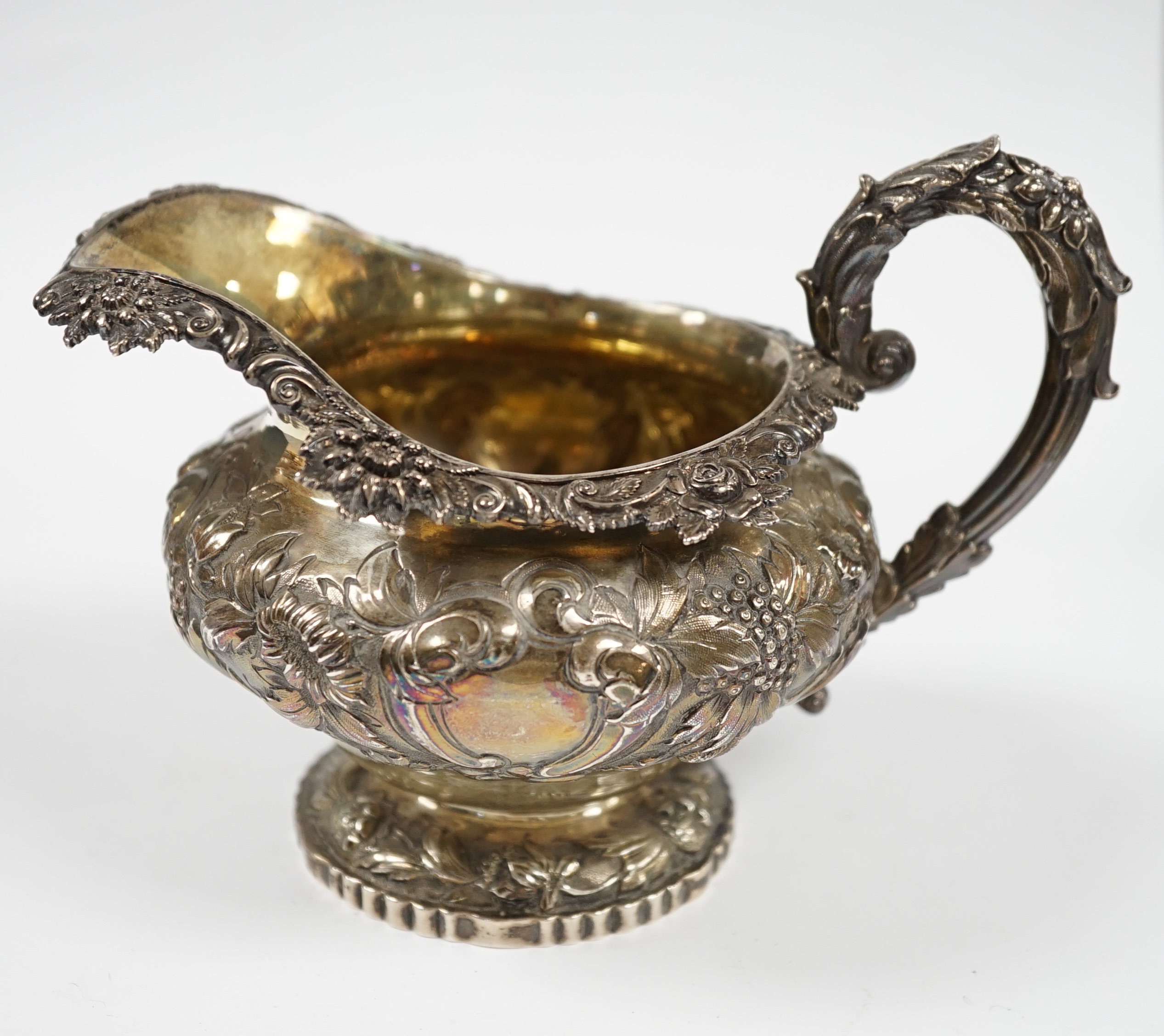 A George IV embossed silver milk jug, by Charles Fox, London, 1826, 11.5cm, 9.3oz. Condition - fair to good